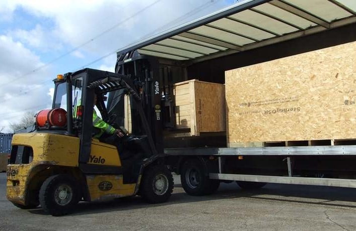 Forklift and crates in yard